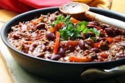 Frying pan full of sausage chili