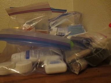 Plastic bags containing contact lens case, hand creme