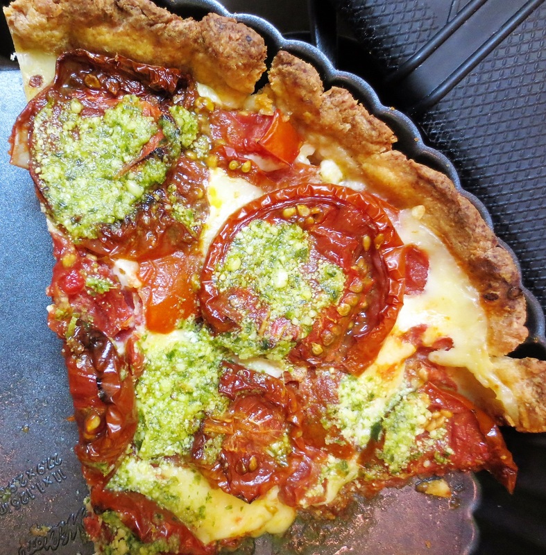 Home made tart with slow roasted tomatoes and pesto