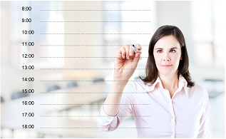 Woman writing a to-do list on a white board