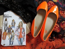 Orange slippers and Halloween vest