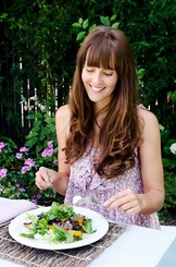 Woman enjoying a seasonal salad