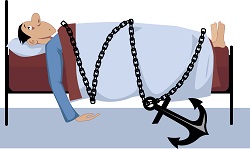 Man tied to his bed with anchor and chain