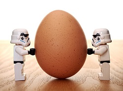 2 Leglo Starwars Storm Troopers trying to move an egg