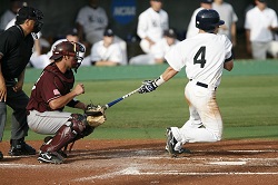 Baseball player taking off from home after hitting the ball