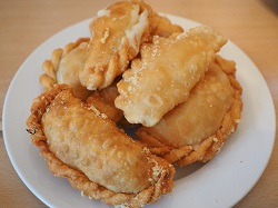 Pile of potstickers on a white plate