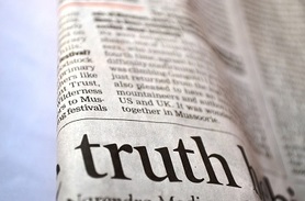 Newspaper showing the word truth