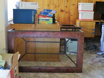 table on its side, desk piled with files